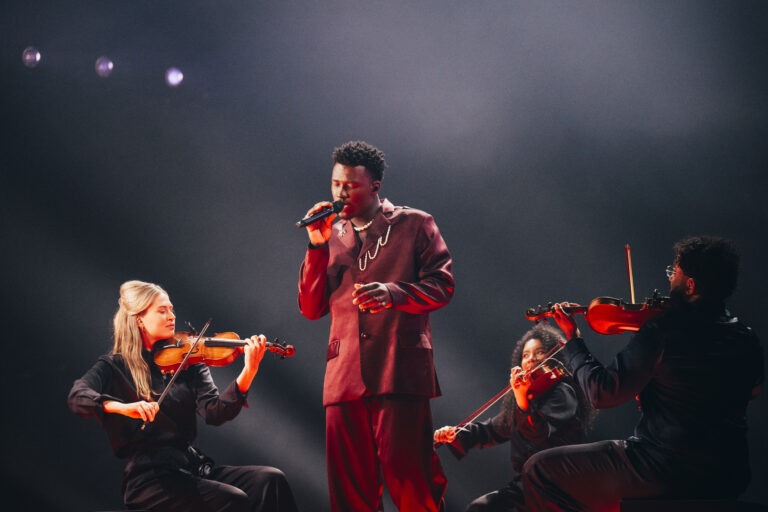 Claude performing C'est La Vie for Netherlands at the First Semi-Final in St. Jakobshalle